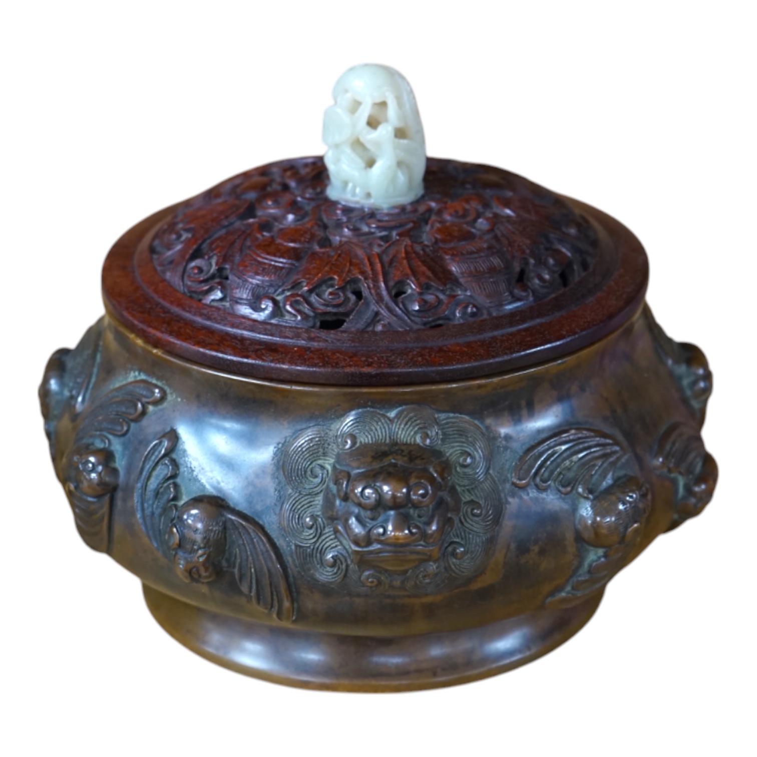 A Chinese bronze censer, with carved wooden cover and jade finial, 17cm high. Condition - good